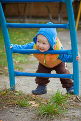 Kid playing outdoors. Child at the playground.