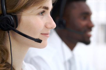 Call center operator.Young beautiful business woman in headset