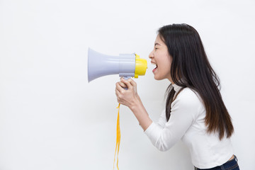 Young Asian woman shouting and screaming with the megaphone on white background with copy space