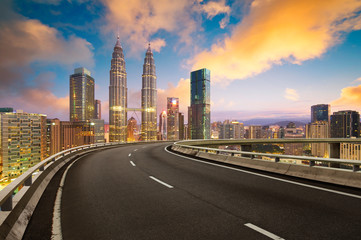 Fototapeta na wymiar Flyover with beautiful Kuala Lumpur city skyline , Twilight scene .