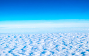 Fototapeta na wymiar Blue sky and Cloud Top view from airplane window,Nature background