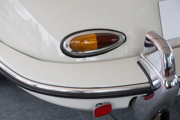 Color detail on the rearlight of a vintage sport car