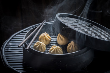 Closeup of chinese dumplings on black background