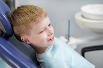 Smiling boy at the dentist's chair