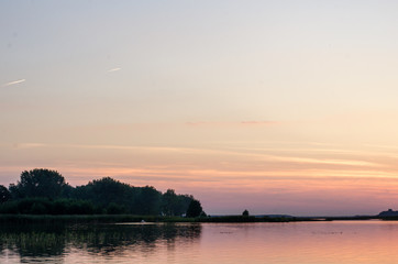 Sunset on the lake. Sunset in the water.