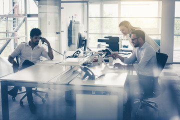 Obraz premium Business people working Business people together in office. Colleague reading document. African business man using Landline.