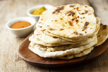 Indian naan bread on wooden desk