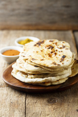 Indian naan bread on wooden desk