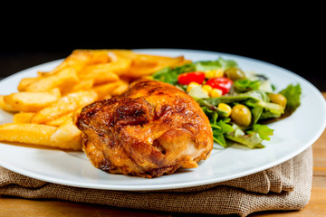 Fresh chicken steak with tomatoes and french fries