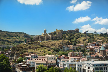 Obraz premium Traditional georgian architecture in Abanotubani historical part of Tbilisi - wooden balconies and stone carvings ,Georgia, unesco heritage