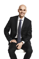 Young elegant man sitting on a chair