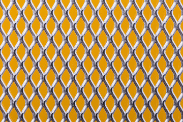 Metal grid on an orange background