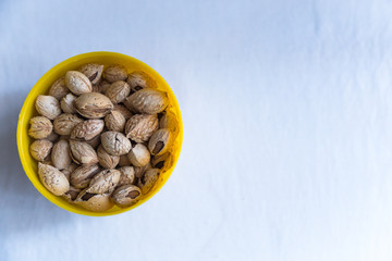 Bowl with unpeeled almond