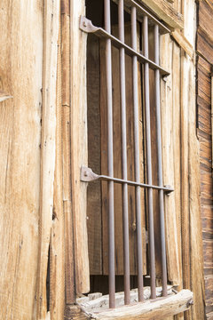 Bars on window of old wooden  jail