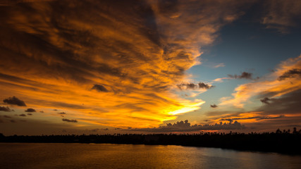 Fototapeta na wymiar Magic sunset view seascape with beautiful colorful sky, sun and clouds