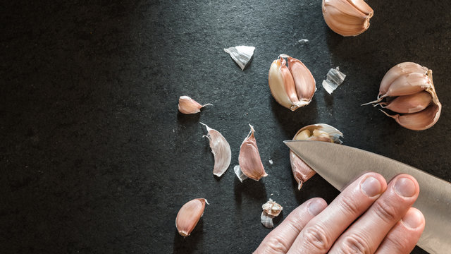 Peeling the garlic with a knife
