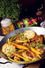 Grilled chicken wings with caramelized carrots
