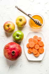 Carrots, pomegranate and apples with honey for the Jewish New Year