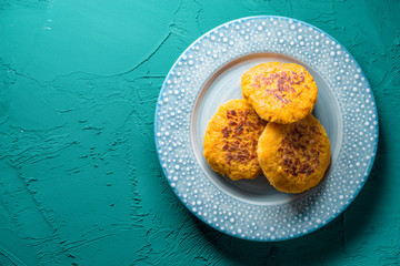 Vegetarian pancake pancakes on a blue plate free space