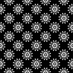 Ornamental seamless pattern. White on black