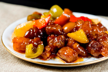 wok fried chicken stir fry with sweet peppers and chinese vegetables