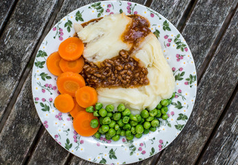 Cottage Pie With Peas and Carrots and Gravy