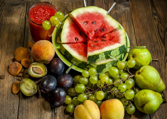 Watermelon smoothies, slices of watermelon and other fruits