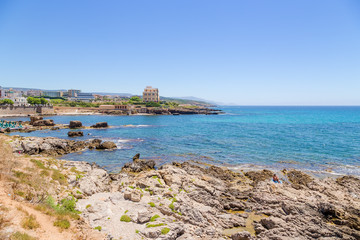 Fototapeta premium Alghero, Sardinia, Italy. Stony bank under the ancient fortress walls