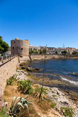Alghero, Sardinia, Italy. A picturesque landscape with ancient bastions on the shore of the bay