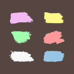 Set of colour brush strokes. Lilac, yellow, green, pink, white, blue brushstrokes isolated on brown background. Grunge, sketch, ink, graffiti, watercolor.