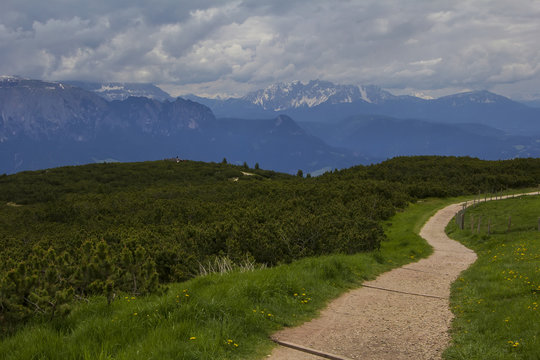 Landscape view of the walking trail near the observation deck on the top of the mountain, in the vicinity of Bolzano, Italy