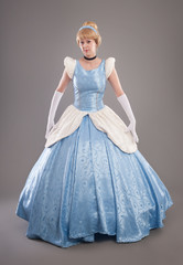 Beautiful woman with golden hair and blue dress like princess © guruXOX