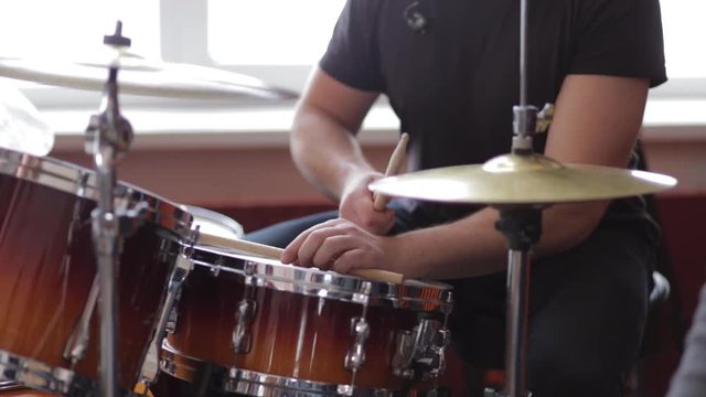 The musician plays the drums