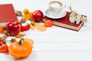Autumn background, cup of cappuccino, the books, space for text.