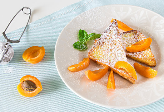 French toasts with fresh cut apricot. Health classic breakfast concept.