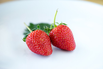 Strawberries with leaves.