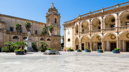 Mazara del Vallo (Italy) - Piazza della Repubblica, with San Vito statue, Palazzo del Seminario and Santissimo Salvatore Cathedral - obrazy, fototapety, plakaty