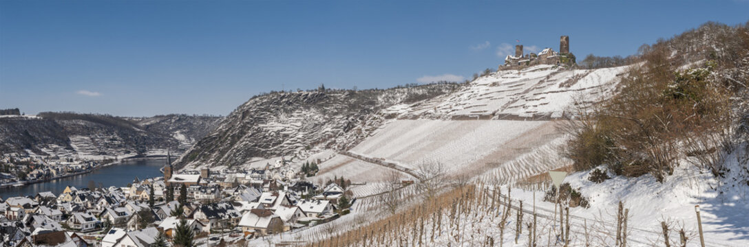 GERMANY, MOSELLE, Castle Thurant above village Alken Mosel valley during winter covered with snow.  It was first mentioned in the 13. century