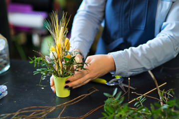 A bouquet of flowers in the hands of a florist