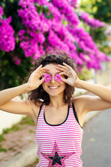 Beautiful girl in violet flowers