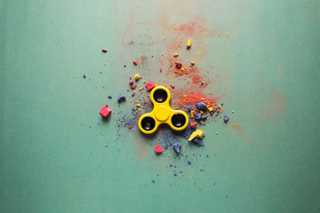yellow spinner on a colored background