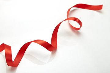 Red curly ribbon isolated on white © 1981 Rustic Studio