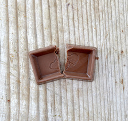 Broken chocolate bar with heart shapes