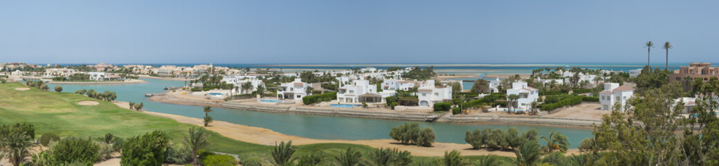 Aerial view of luxury waterfront holiday villas on coast