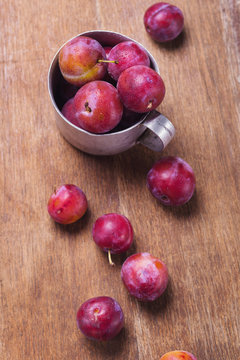 plums in old cup