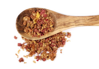 Crunchy granola, muesli pile with blackberry and raspberry in wooden spoon isolated on white background, top view