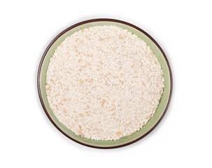 Pile of integral spelt wheat flour in porcelain bowl, dish isolated on white