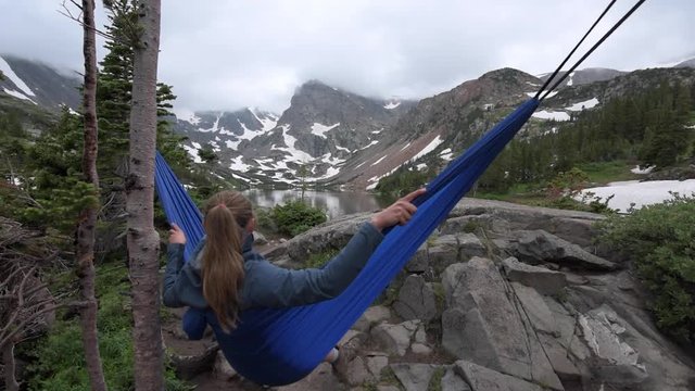 Woman relaxes on a hammock lake Isabelle Colorado