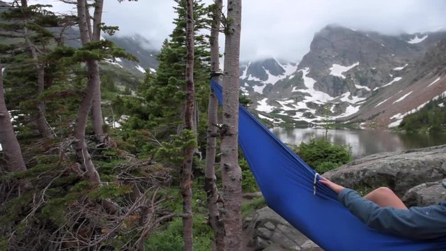 Woman relaxes on a hammock lake Isabelle Colorado