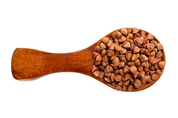 Fototapeta premium Buckwheat in a wooden spoon on a white background